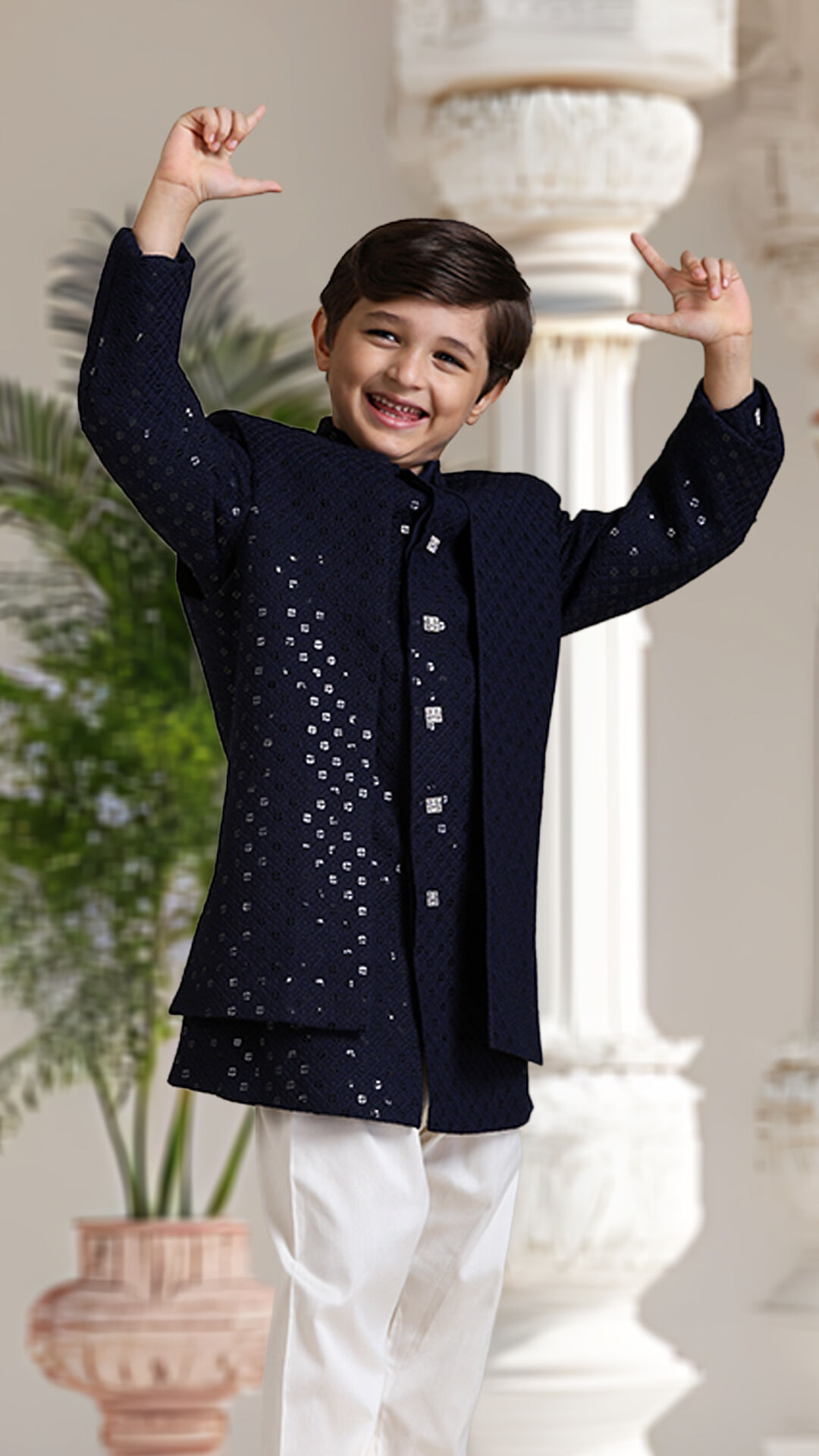 A boy flaunting his black indo western sherwani to shine in wedding